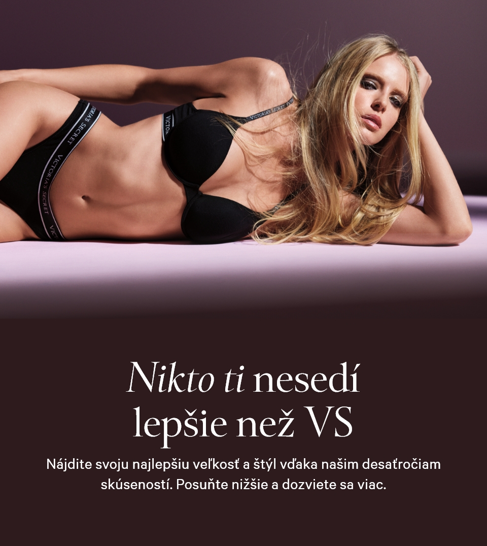 Woman posing in Victoria's Secret bra and panties on a deep purple background