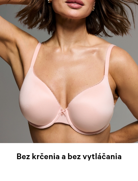 Woman posing in a Victoria's Secret full coverage baby pink bra.