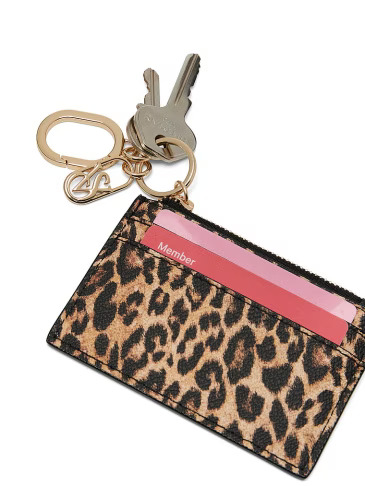 Victoria's Secret lepard print card holder with cards inside and keychain attached to it