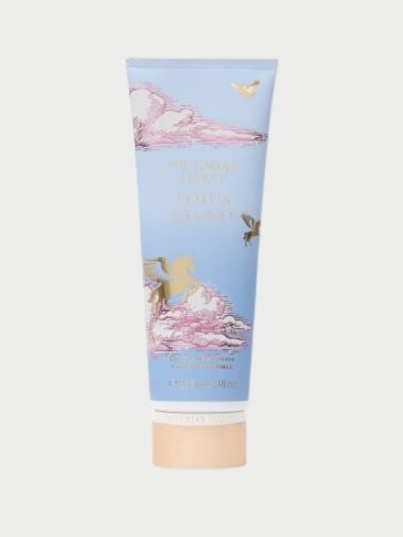 Victoria's Secret pink bottle of Perfumed lotion on a light grey background