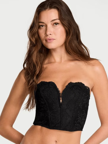 Front view of a woman wearing Victoria's Secret Winter Wine satin cami and shorts set on a light grey background.
