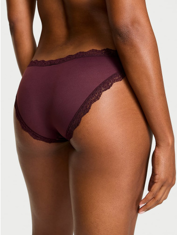 Back view of a woman wearing Victoria's Secret signature strips Huphugger panties